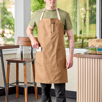 Tạp dề yếm vải 100% cotton có thể tùy chỉnh Uncommon Chef 3104 Rebel nâu caramel, dây viền tự nhiên và 3 túi