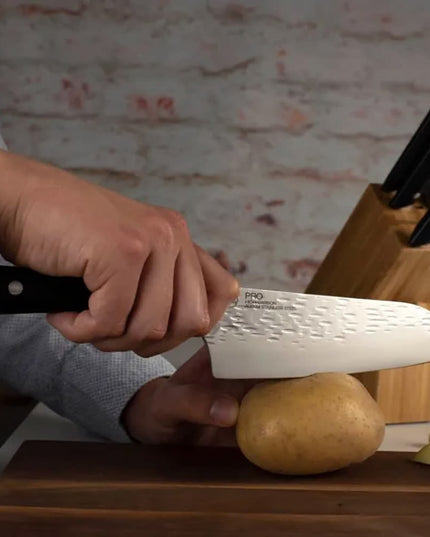 Dao Santoku Kai HT7064 17.8 cm Cán POM Đen Lưỡi Thép Không Gỉ