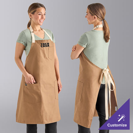 Tạp dề yếm vải 100% cotton có thể tùy chỉnh Uncommon Chef 3104 Rebel nâu caramel, dây viền tự nhiên và 3 túi