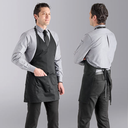 Tạp dề tuxedo cổ V vải twill poly-cotton có thể tùy chỉnh Uncommon Chef 3041 đen, dây cổ điều chỉnh và 2 túi