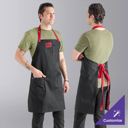 Tạp dề yếm vải poly-cotton có thể tùy chỉnh Uncommon Chef 3104 Rebel đen, dây viền đỏ và 3 túi